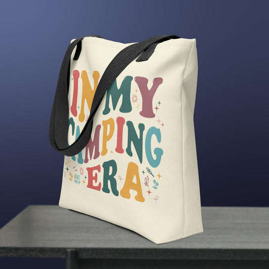 a white canvas bag with the words in my camping era printed on it