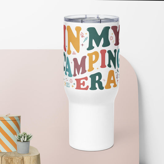 a white tumbler cup with the words in my camping era printed on it