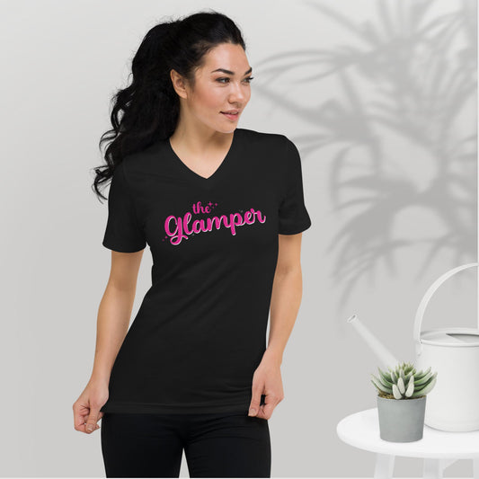 a woman wearing a black t - shirt that says the glamour